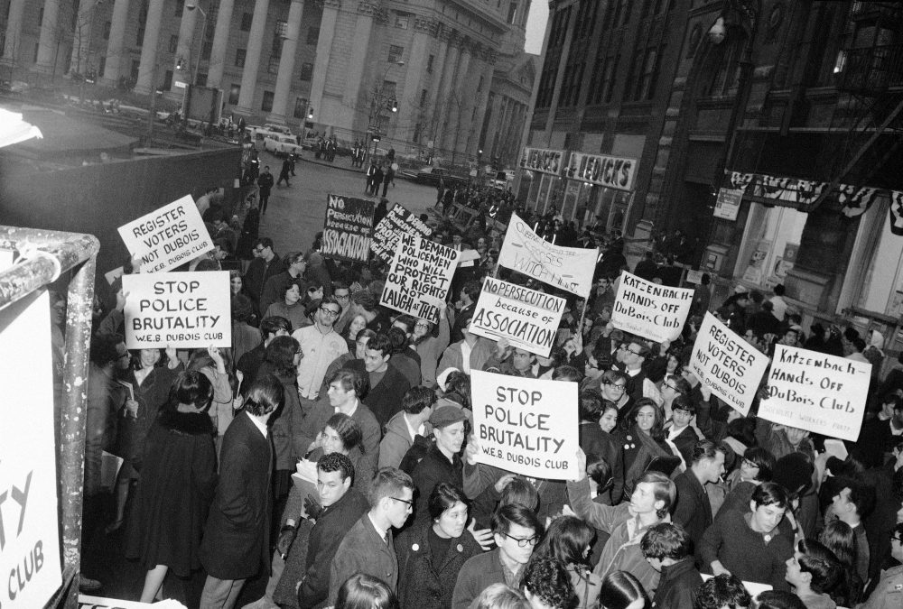 Some 200 members of the W.E.B. Dubois Club carry banners and placards as they demonstrate in front of New York’s City Hall, March 11, 1966. The youths were protesting “police brutality” and attorney general Katzenback’s recent effort to have the organization register as a Communist front. (John Lindsay/AP)