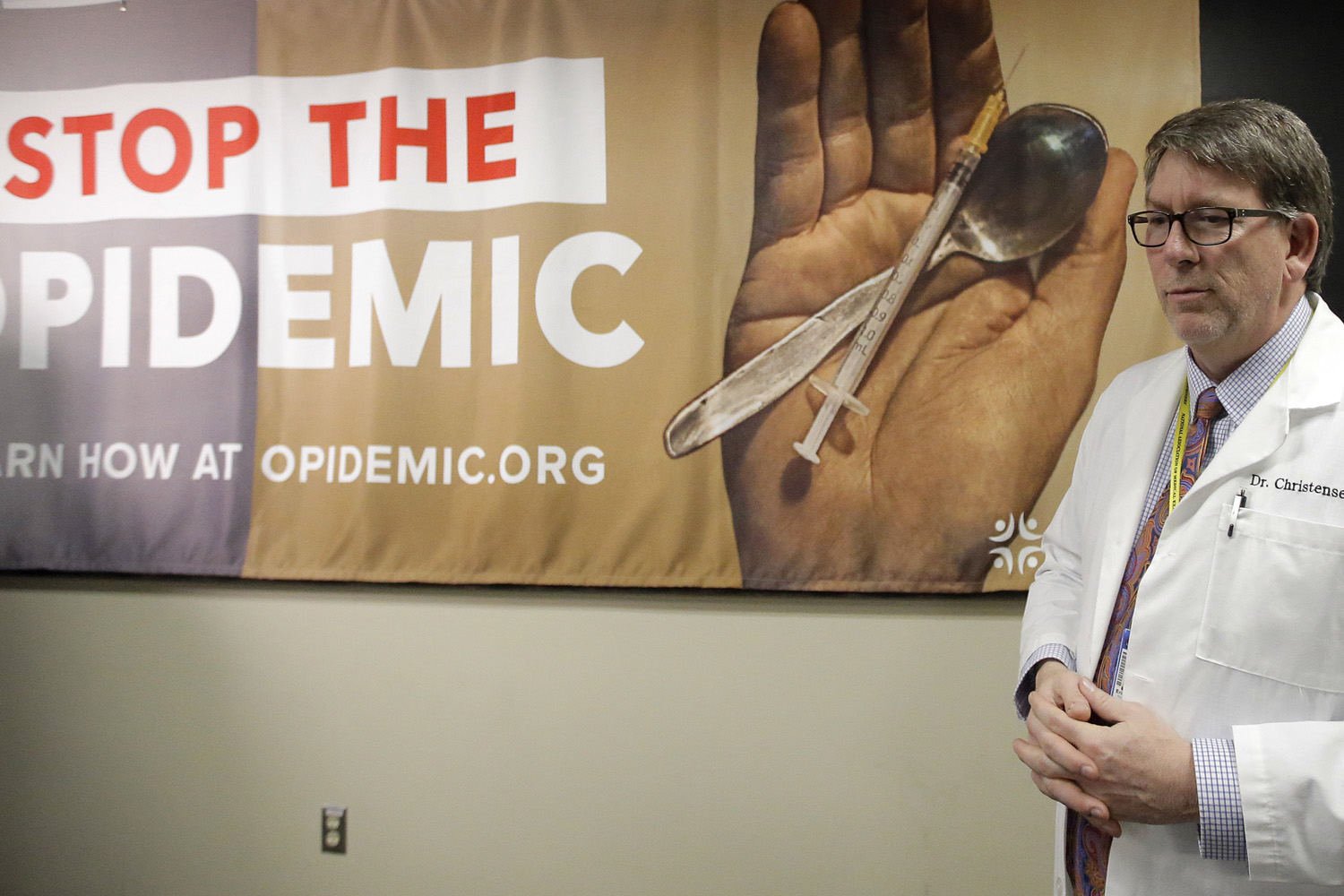 Dr. Erik Christensen, Chief Medical Examiner, Utah Department of Health, looks on during a Utah Department of Health press conference during their new campaign Stop the Opidemic. (Rick Bowmer/AP)
