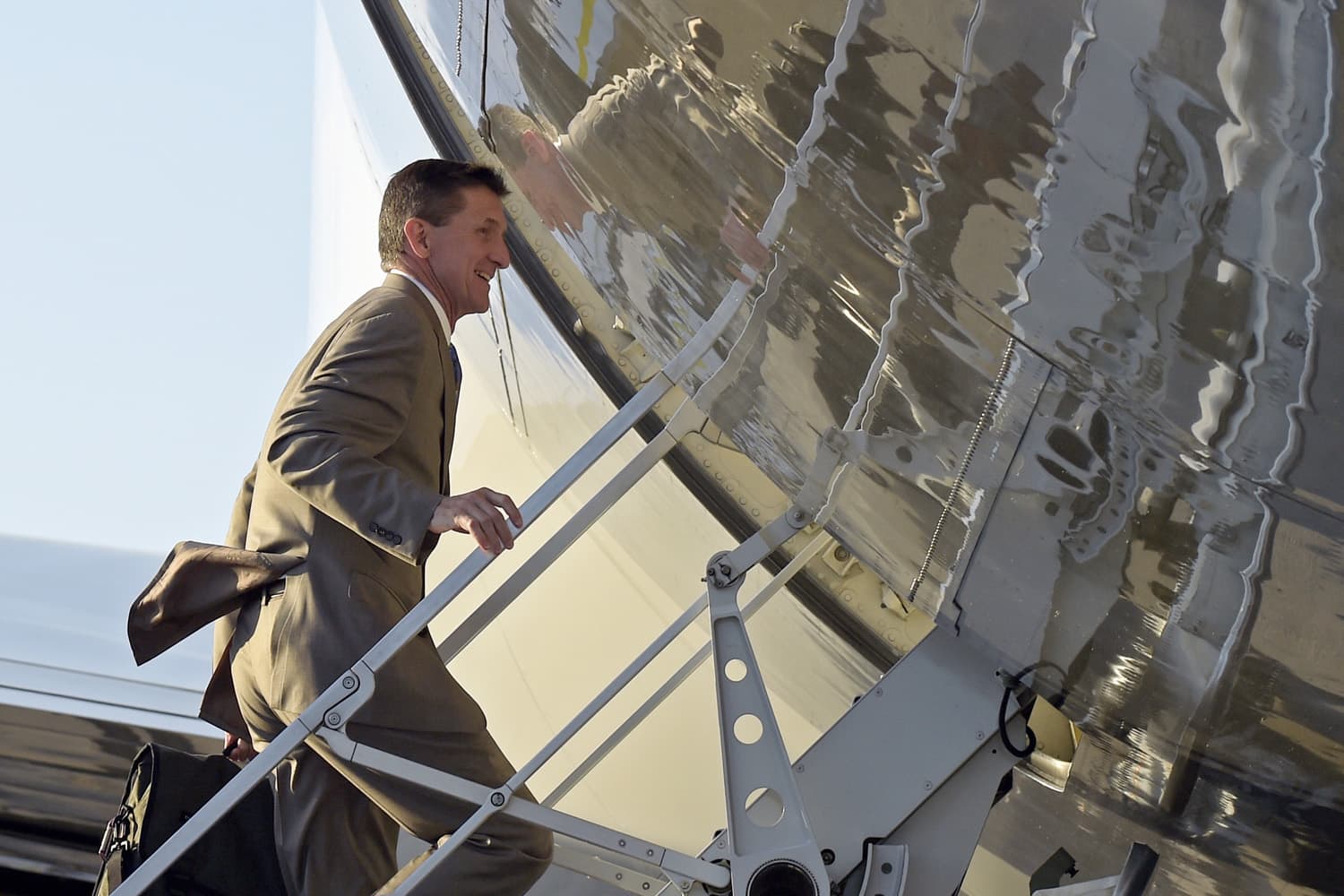 In this Feb. 12, 2017, photo, former National Security Adviser Michael Flynn boards Air Force One at Palm Beach International Airport in West Palm Beach, Fla., as he return to Washington with President Donald Trump. (Susan Walsh/AP)