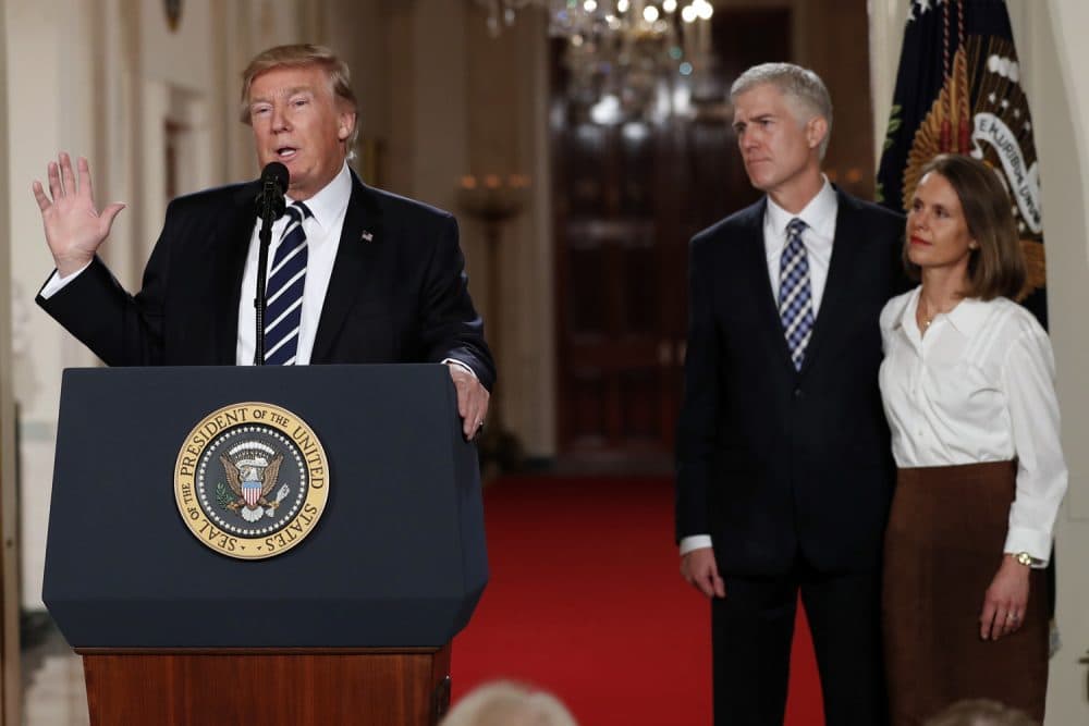 President Trump speaks in the East Room of the White House to announce Judge Neil Gorsuch as his nominee for the Supreme Court. Gorsuch stands with his wife Louise. (Carolyn Kaster/AP)