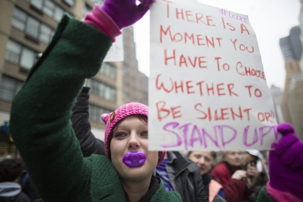 Teen Vogue is tapping into a more outward-looking set of aspirations and concerns among a generation far more worldly than the one that read their mothers’ Vogue, writes Julie Wittes Schlack. Pictured here: Suzie McCarthy of Jersey City, N.J., participates in a women's march in New York, Saturday, Jan. 21, 2017.  (Mary Altaffer/AP)