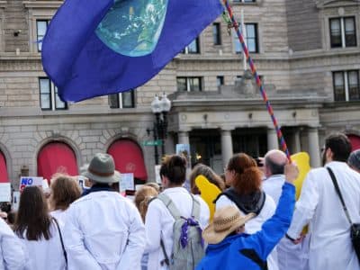 Many who attended the &quot;Stand Up for Science&quot; rally Sunday in Copley Square wore their lab coats. (Max Larkin/WBUR)
