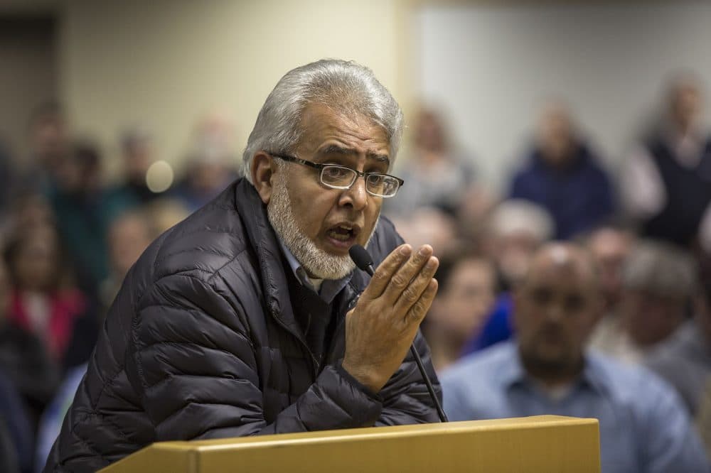 In this Feb. 2016 file photo, Dr. Khalid Khan Sadozai answers questions from the Dudley Board of Selectmen. (Jesse Costa/WBUR)