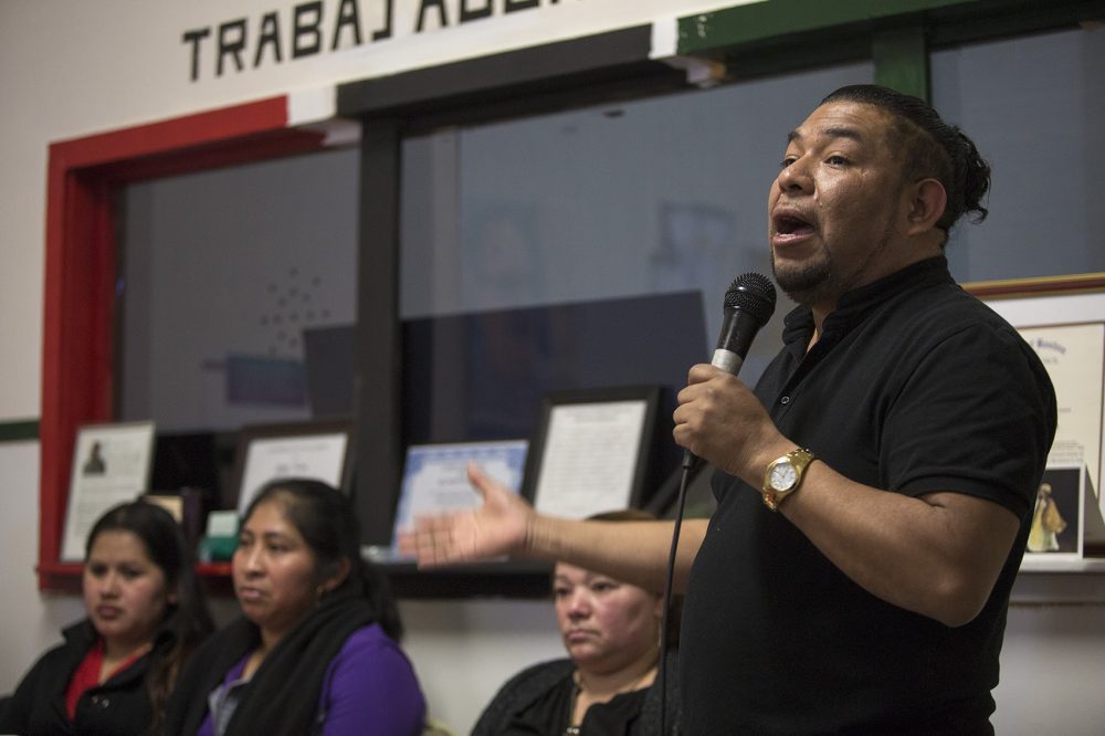 Adrian Ventura, director of Centro Comunitario Trabajadores (CCT), or Community Workers Center, in New Bedford speaks during a community meeting recognizing both 10th year anniversaries of CCT and the Michael Bianco factory raid. (Jesse Costa/WBUR)