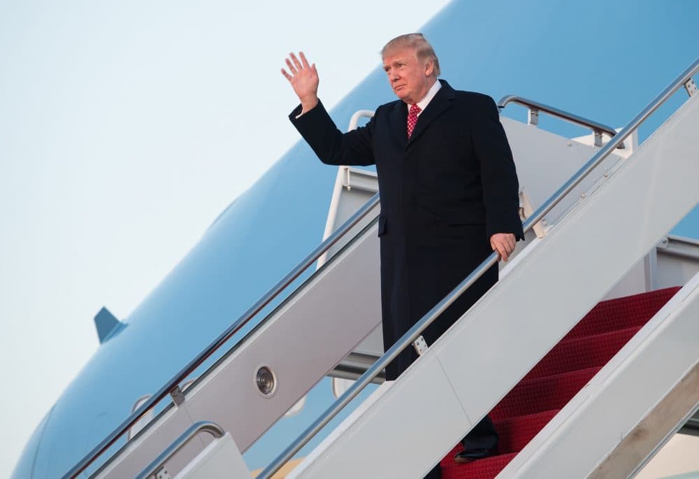 President Donald Trump waves as he steps off Air Force One at Andrews Air Force Base in Maryland on March 5, 2017. (Nicholas Kamm/AFP/Getty Images)