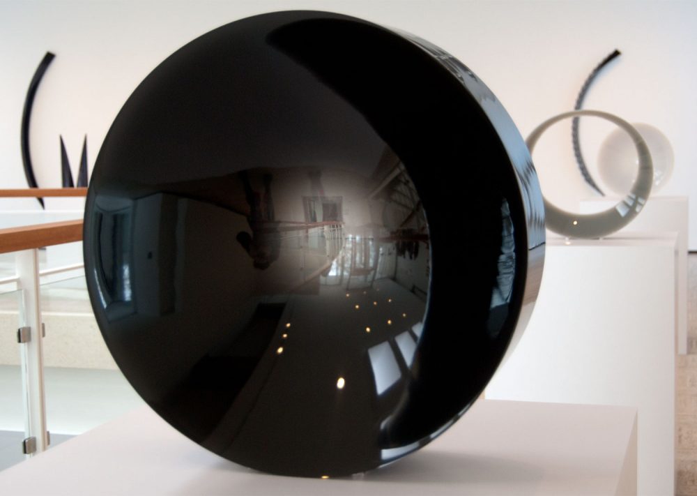 Fred Eversley's untitled 1974 cast polyester resin lens (center) in the exhibit &quot;Black, White, Gray,” an exhibition at Brandeis University’s Rose Art Museum. (Greg Cook/WBUR)