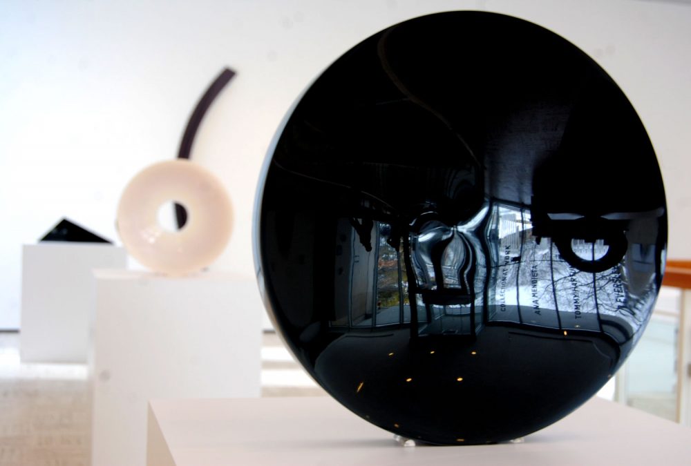 Fred Eversley's untitled 1974 cast polyester resin lens (right) in the exhibit &quot;Black, White, Gray,” an exhibition at Brandeis University’s Rose Art Museum. (Greg Cook/WBUR)