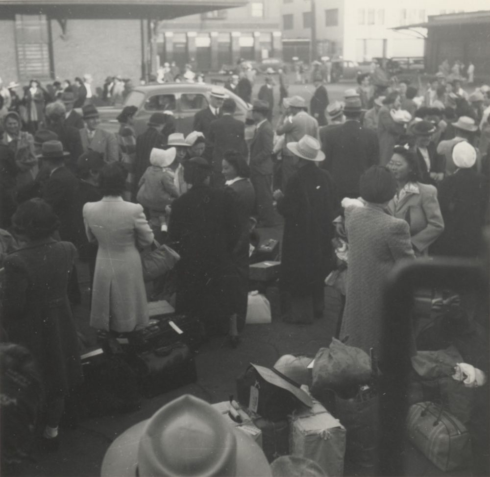 Japanese Americans wait at a Los Angeles, Calif., train station. They are bound for Parker, Ariz. (Poston concentration camp), May 29, 1942. (Courtesy Japanese American National Museum, gift of Susan K. Mochizuki and Ann K. Uyeda)