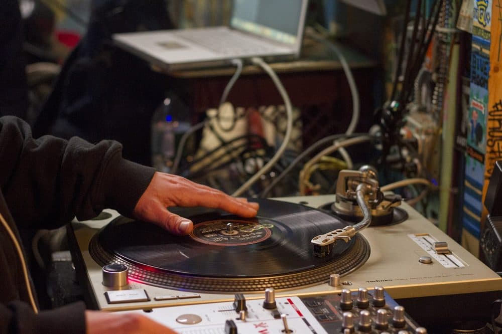 A DJ spins records at the Freestyle Clinic. (Joe Difazio for WBUR)