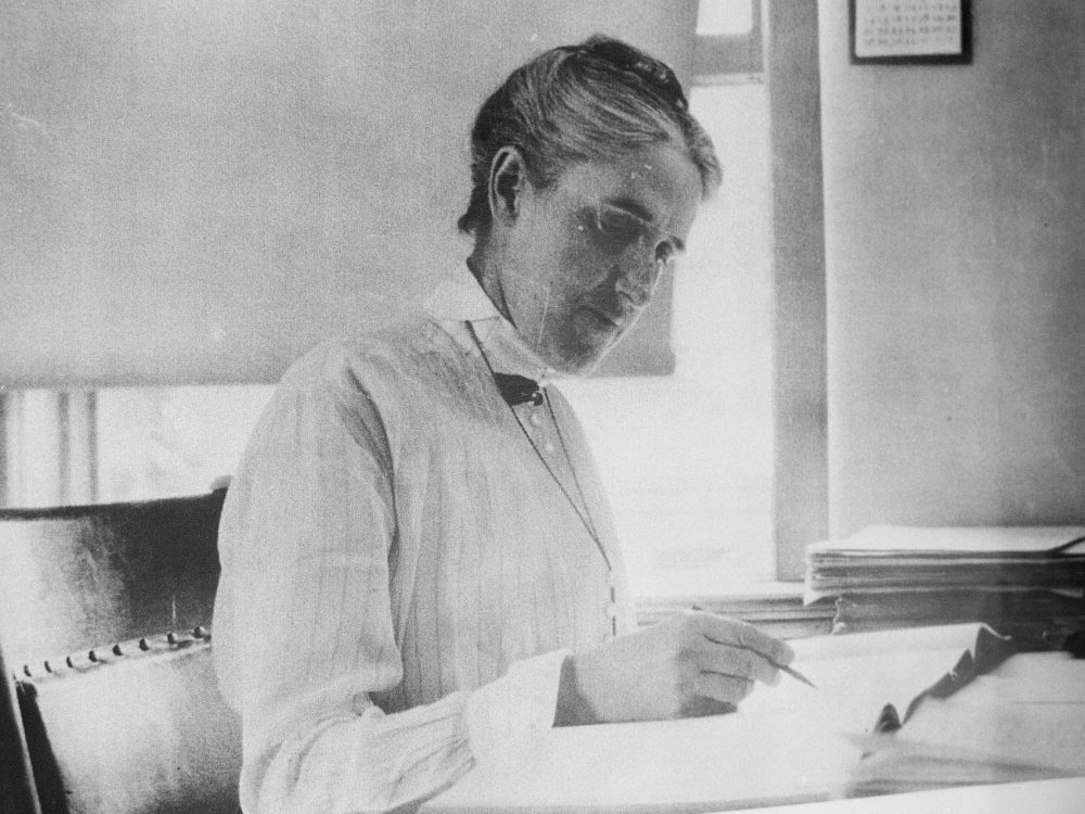 A photo of Henrietta Swan Leavitt pinned to a bulletin board inside the Harvard Observatory’s Plate Stacks. (Andrea Shea/WBUR)