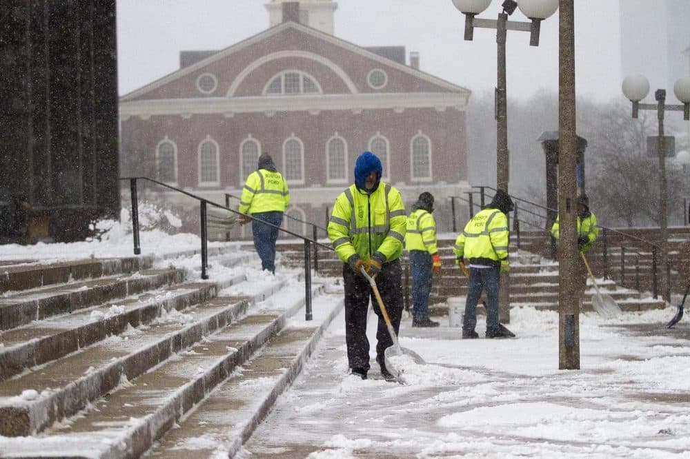 Workers clear the steps at City Hall. (Jesse Costa/WBUR)