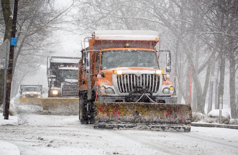 Snow plows moved along Mt. Auburn Street in Cambridge Tuesday morning. (Robin Lubbock/WBUR)