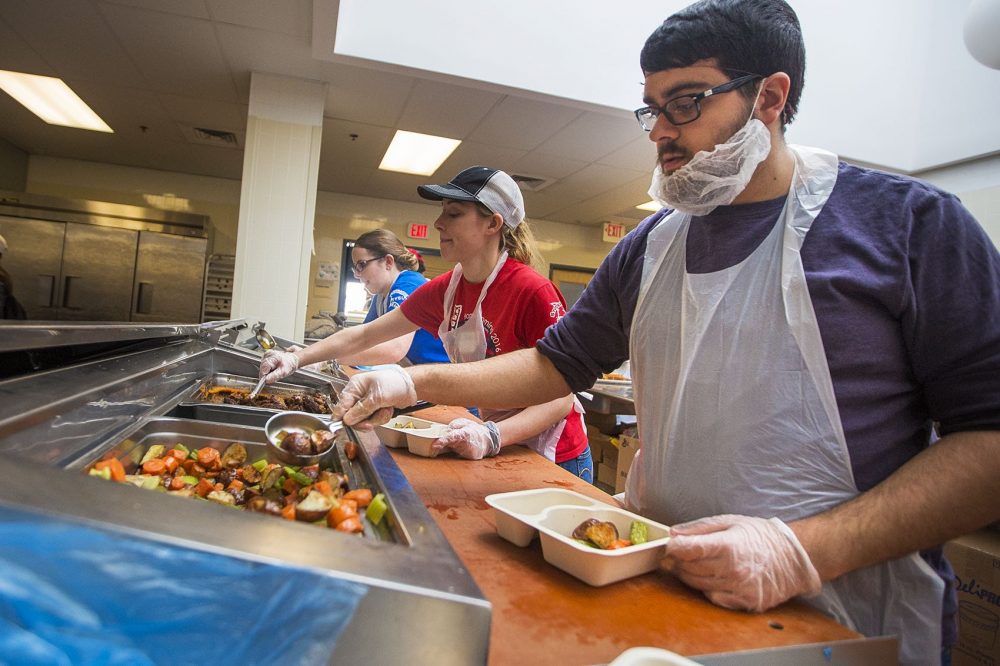 Volunteers at Community Servings in Jamaica Plain pack &quot;medically tailored&quot; meals for patients with serious illnesses and strict dietary requirements. (Jesse Costa/WBUR)