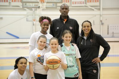 Sydney (green jersey), her friends and members of the New York Liberty organization. (Courtesy of New York Liberty)