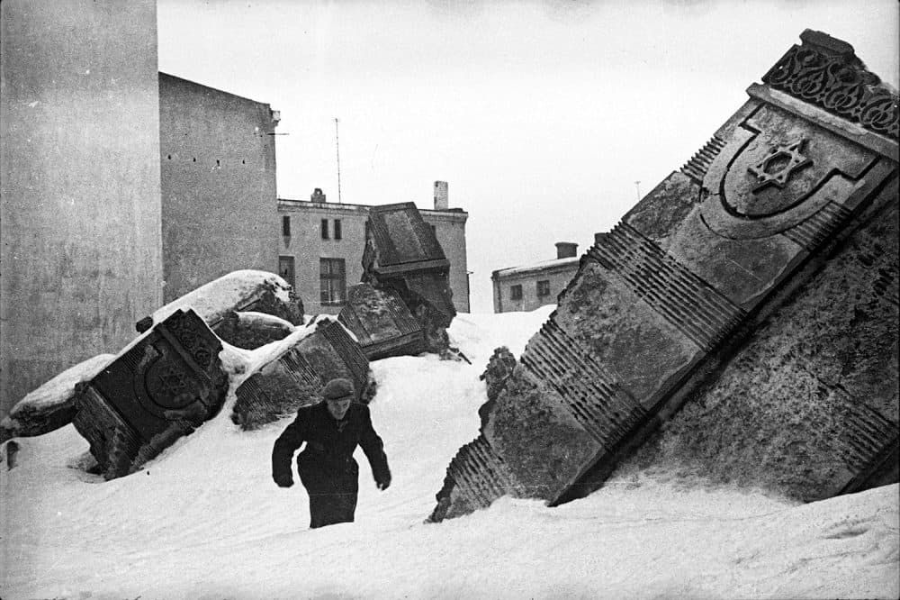 Henryk Ross' 1940 photo of a man walking in winter in the remains of the Lodz synagogue on Wolborska Street, destroyed in 1939 by the Germans. (Courtesy, Museum of Fine Arts, Boston)