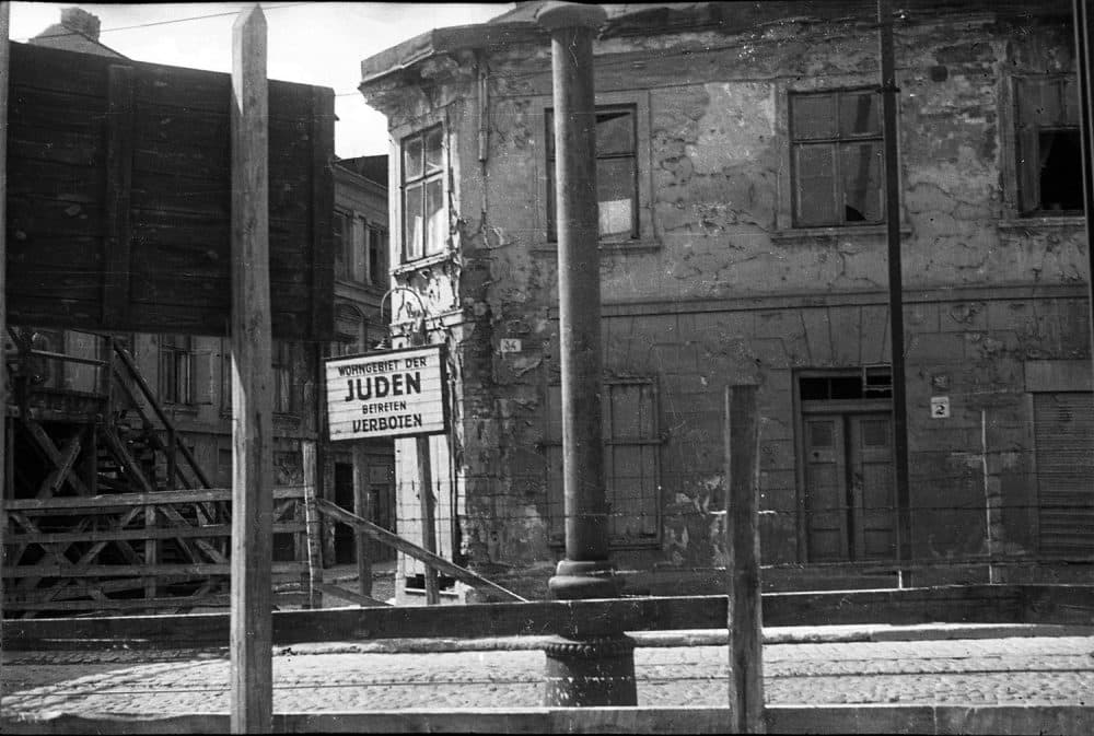 Henryk Ross photo of a Lodz Ghetto entrance sign saying: “Wohngebiet der Juden Betreten Verboten” (“Residential area of the Jews, entry forbidden”), c. 1940-1944. (Courtesy, Museum of Fine Arts, Boston)