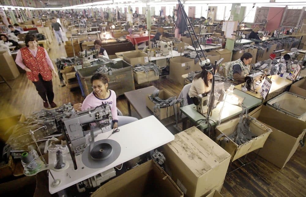 Workers work on military garments at the Michael Bianco Inc. factory in New Bedford on March 22, 2007. (Stew Milne/AP)