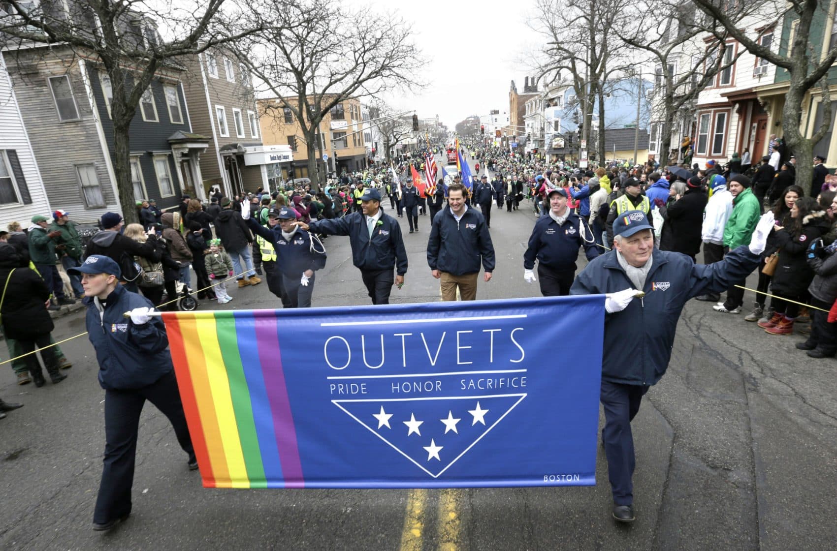Tom Keane: "Why the backsliding? Why the change of heart? What on the political scene could possibly have prompted a reversal? Oh, yeah." Rep. Seth Moulton, center without hat, marches with members of OutVets, during the St. Patrick's Day parade on March 15, 2015. (Steven Senne/AP)