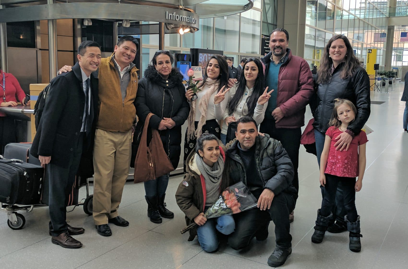 Banah Al-Hanfy, third from right, at Logan International Airport with her family and the Maine residents who helped reunite them (Courtesy of Brian Eng)