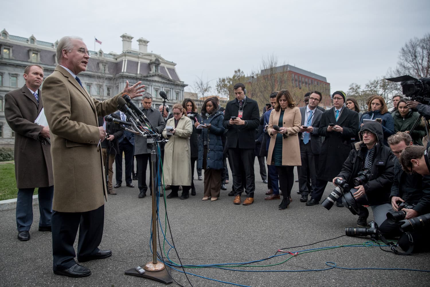 Health and Human Services Secretary Tom Price, accompanied by Budget Director Mick Mulvaney, left, speaks outside the West Wing of the White House in Washington. (Andrew Harnik/AP)