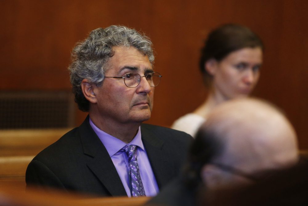 Dr. Roger Kligler sits in Suffolk Superior Court in Cambridge, Mass., during a hearing Wednesday on March 8 in a lawsuit filed by him seeking a judge's ruling that current state law allows physicians to offer aid-in-dying medication to terminally ill adult residents. (Jessica Rinaldi /The Boston Globe via AP, Pool)