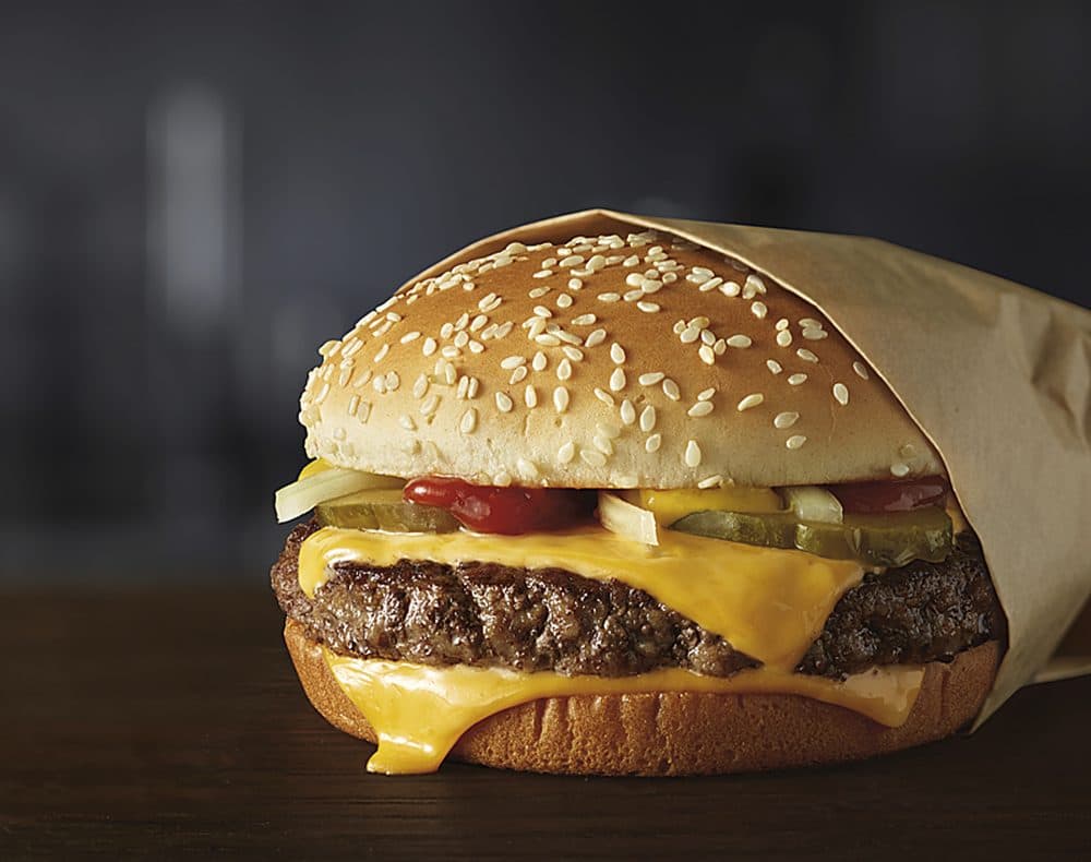 This image provided by McDonald’s Corporation shows a Quarter Pounder burger. McDonald's says it will swap frozen beef patties for fresh ones in its Quarter Pounder burgers by sometime in 2018 at most of its U.S. locations. (Courtesy of McDonald’s Corporation via AP)