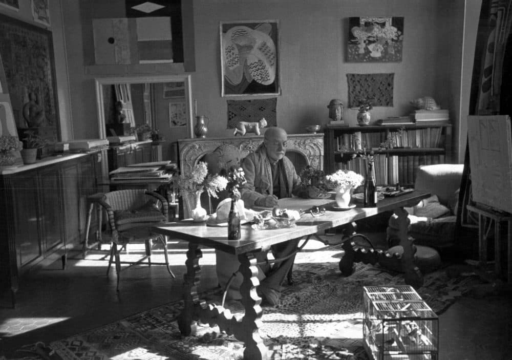 Matisse with his collection of Kuba cloths and a Samoan tapa on the wall behind him as photographed by Henri Cartier-Bresson at the artist's home and studio in Vence, France, in 1944. (Courtesy Museum of Fine Arts, Boston)