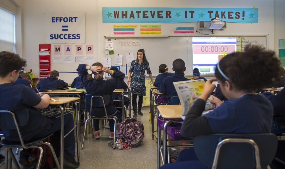 In front of her students, Boston Collegiate Charter School teacher Bridget Adam acts as more of a facilitator or moderator than traditional teacher. (Jesse Costa/WBUR)
