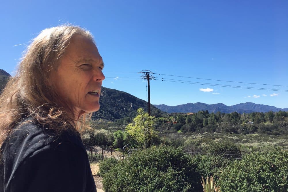 Schmit outside his home in California's Santa Monica Mountains. (Robin Young/Here &amp; Now)