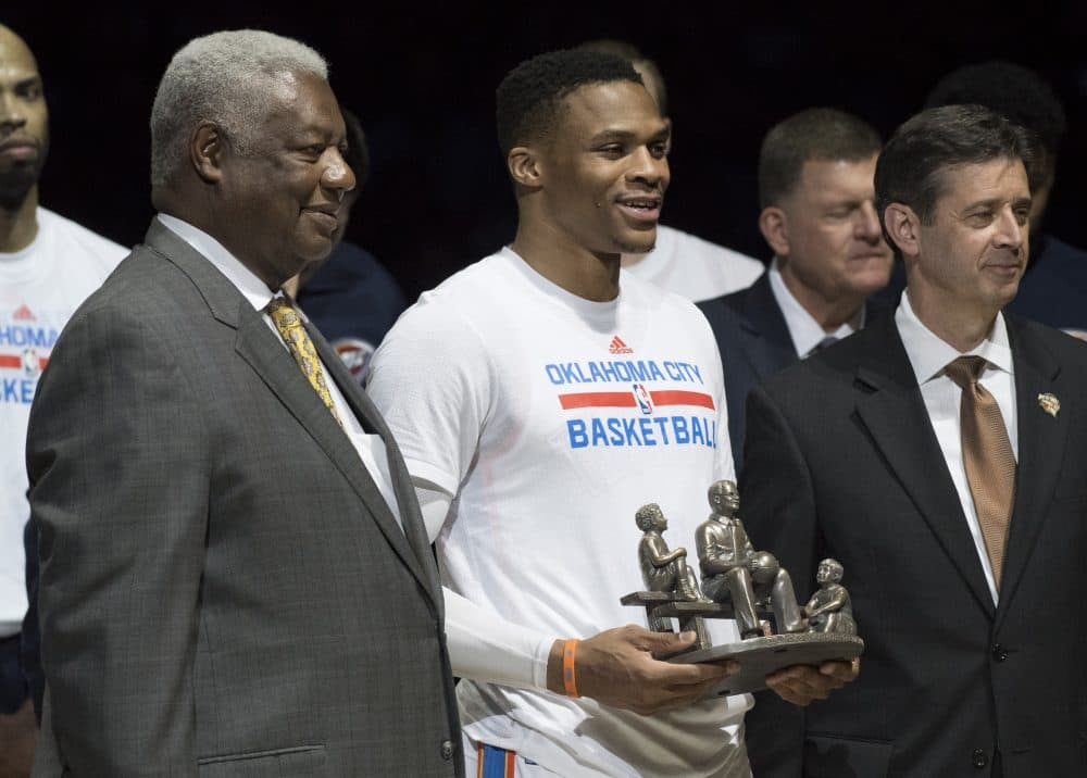 Russell Westbrook (center) received a trophy for breaking Oscar Roberston's (left) triple-double record. (J Pat Carter/Getty Images)