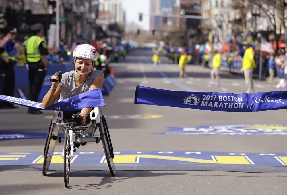Manuela Schar, of Switzerland, wins the women's wheelchair division. She's the first woman to have ever beaten the 1:30 mark. (Elise Amendola/AP)