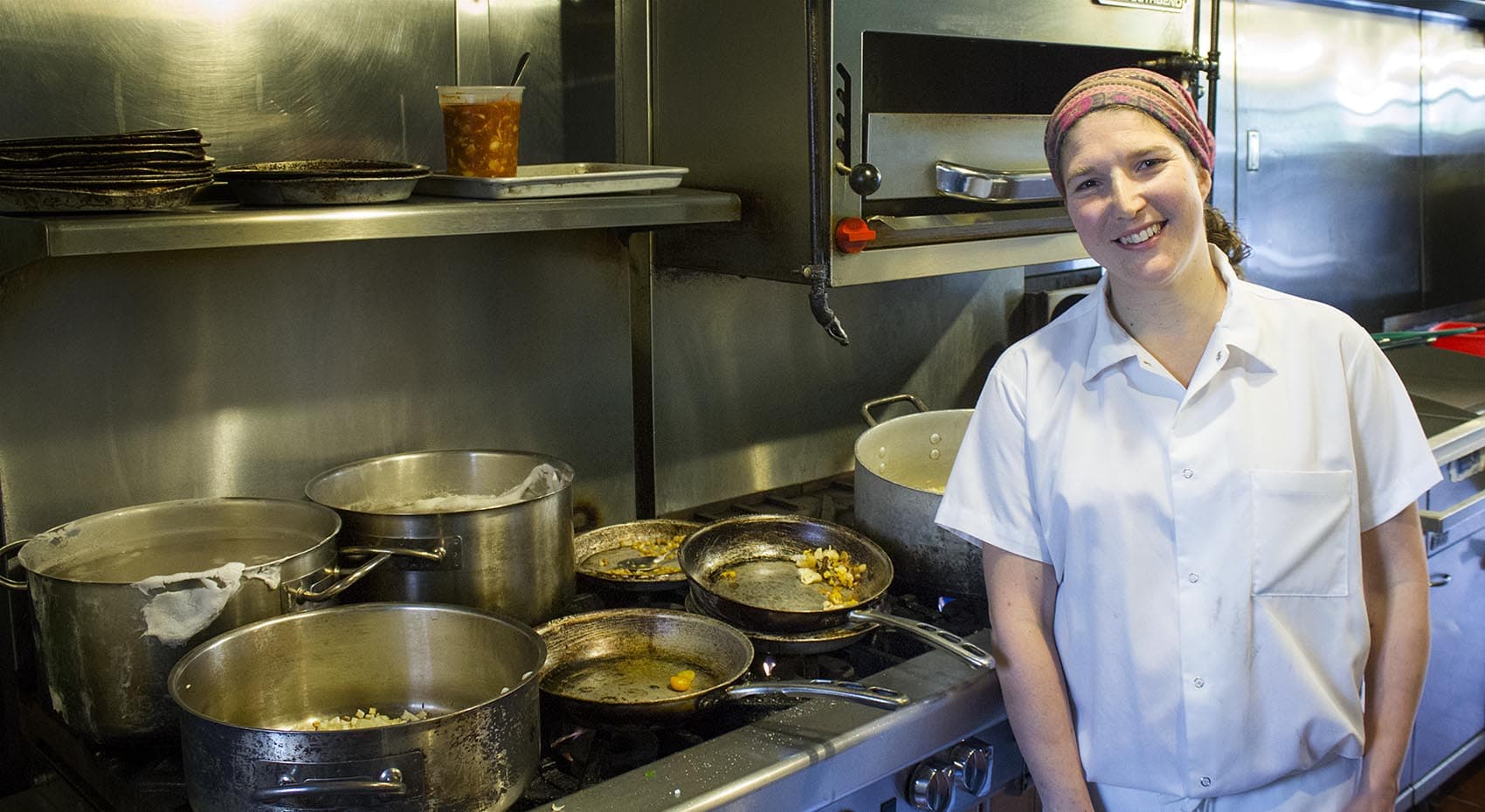 Cassie Piuma in the kitchen of Sarma. (Alison Bruzek/WBUR)