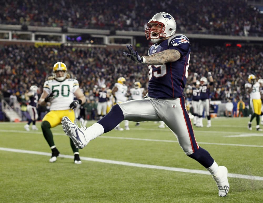 Patriots tight end Aaron Hernandez high steps into the end zone during the fourth quarter of New England's 31-27 win against the Packers on Dec. 19, 2010. (Winslow Townson/AP)