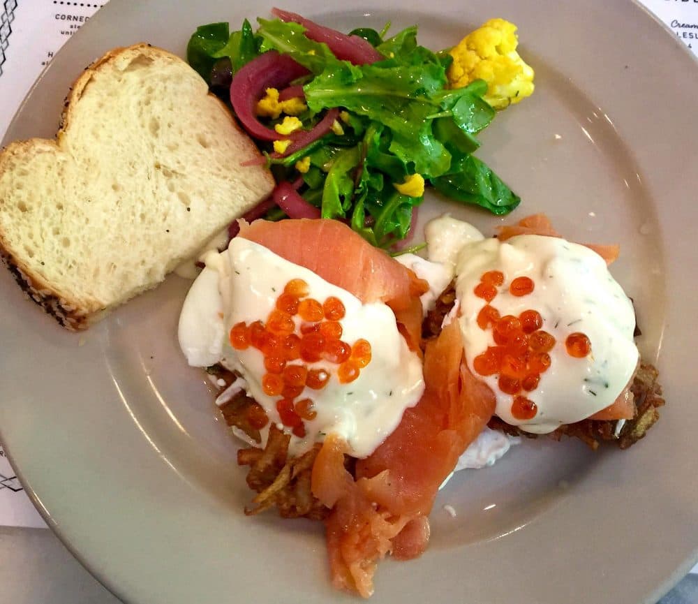 The Benny Goodman at Perly's Restaurant and Deli in Richmond, Va.: Two latkes (potato pancakes) topped with smoked salmon, poached eggs, dill hollandaise and salmon roe. (Kathy Gunst for Here &amp; Now)