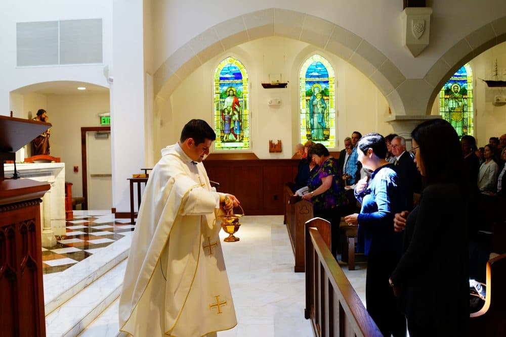 Father Gerald Souza holds Mass inside the newly built Catholic shrine on Sunday. (Simón Rios/WBUR)
