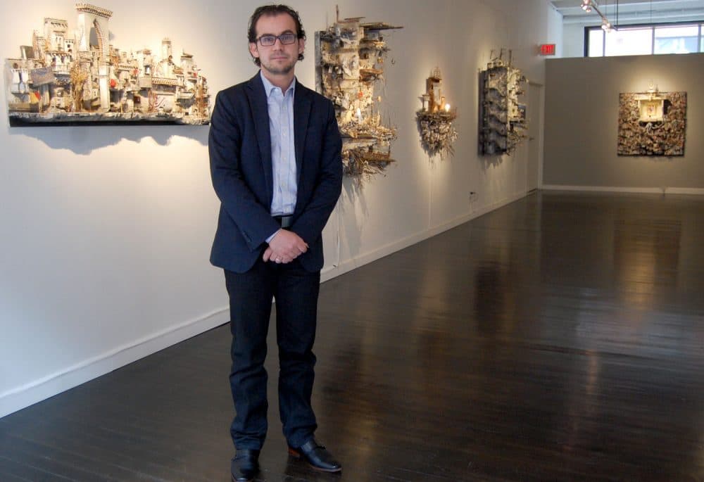 Mohamad Hafez at his exhibition “HOMELAND inSECURITY&quot; at Boston's Lanoue Gallery. (Greg Cook/WBUR)
