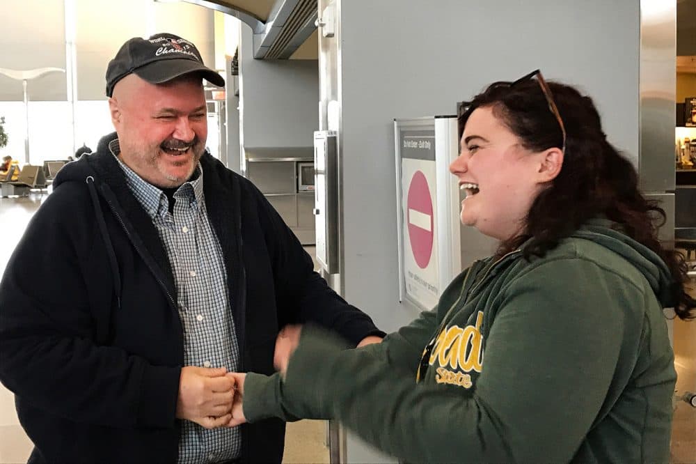 Sean Bunn and his daughter Niki Ilse meet for the first time at the Raleigh-Durham Airport in March. (Photo by Marion Bunn)