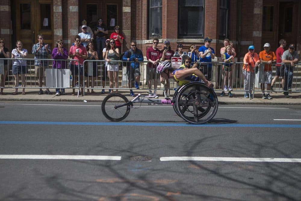 Manuela Schar, of Switzerland, races up Hereford Street, just before the final stretch to the finish line on Boylston Street. (Jesse Costa/WBUR)