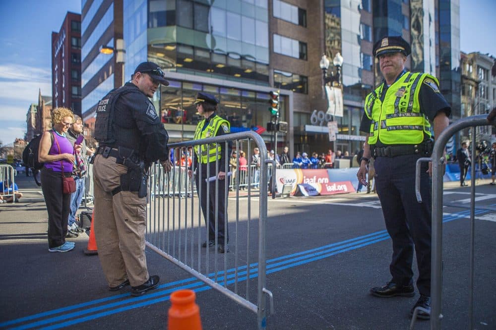 Police block off Boylston Street at Exeter Street prior to the beginning of the race. (Jesse Costa/WBUR)