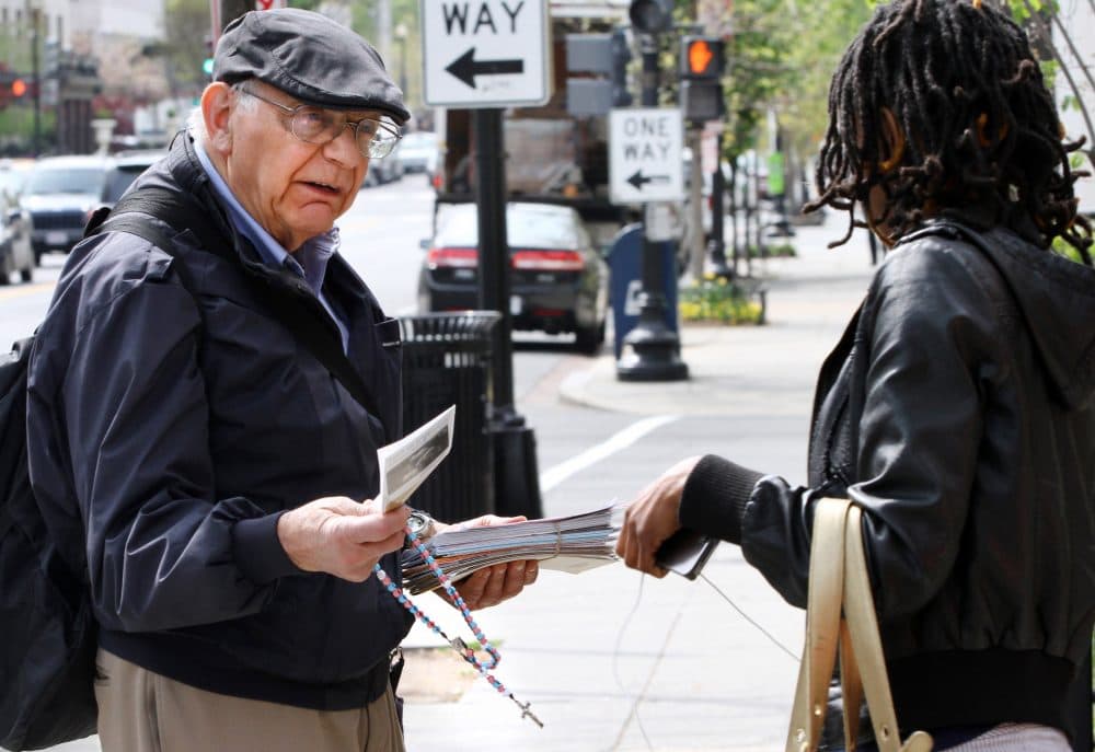 Not talking about abortion, writes Carol Sanger, distorts the public debate, which influences the legislative process. Pictured: Richard Retta, 80, left, hands an anti-abortion flyer to a woman as she leaves Planned Parenthood in Washington on April 4, 2012. (Jacquelyn Martin/AP)