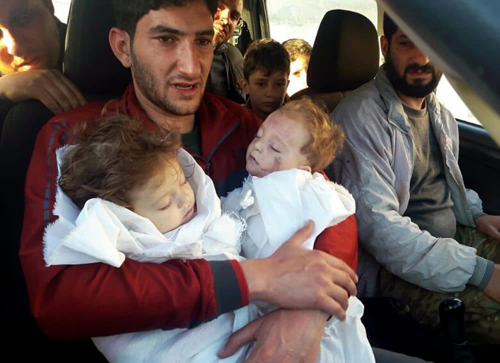 Sabdul-Hamid Alyousef, 29, holds his twin babies who were killed during a suspected chemical weapons attack, Tuesday, April 4, 2017, in Khan Sheikhoun in the northern province of Idlib, Syria. Alyousef also lost his wife, two brothers, nephews and many other family members in the attack that claimed scores of his relatives. (Alaa Alyousef/ AP)