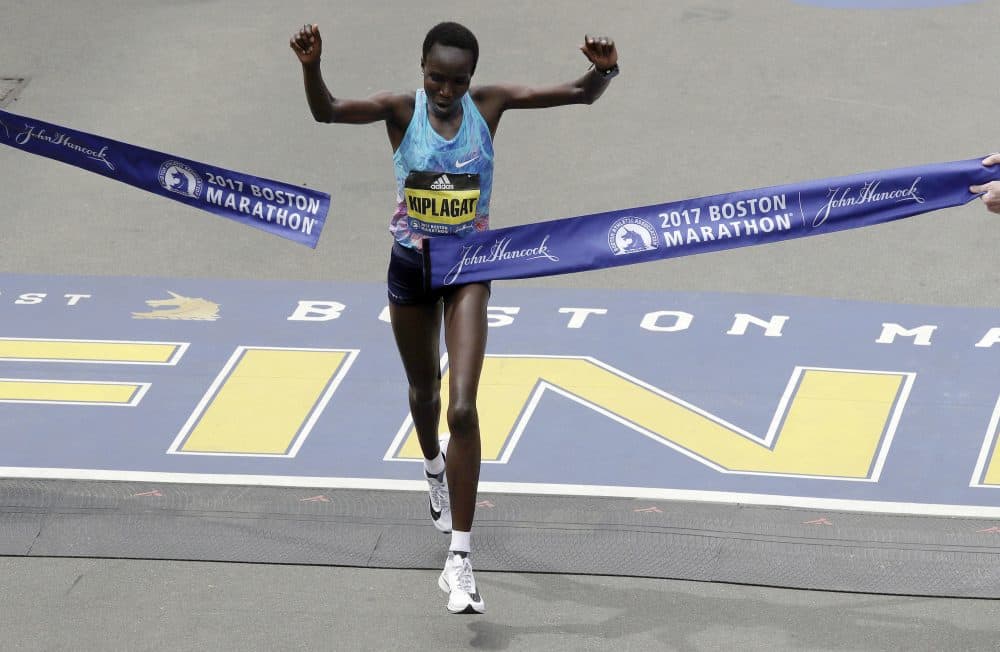 Edna Kiplagat of Kenya wins the women's division of the 121st Boston Marathon. (Charles Krupa/AP)