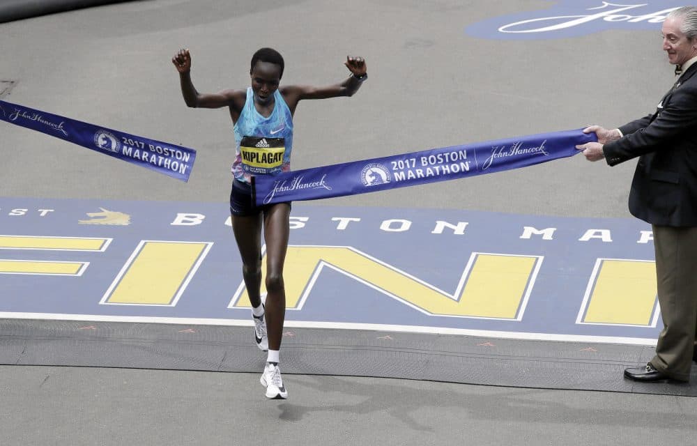 Edna Kiplagat, of Kenya, wins the women's division of the 121st Boston Marathon. Bahrain's Rose Chelimo took second and American Jordan Hasay came in third. (Charles Krupa/AP)