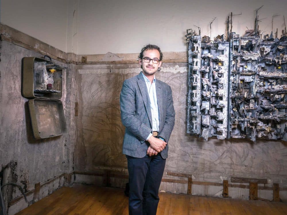 Artist Mohamad Hafez stands with his work. (Courtesy of Mohamad Hafez)