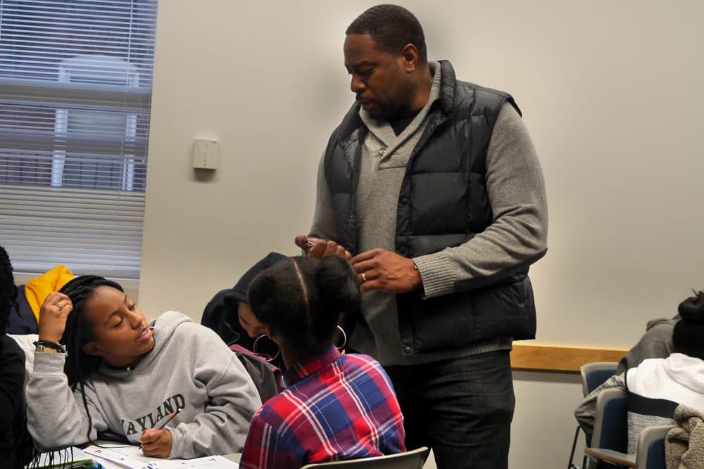Adrian Mims speaks to students during a Calculus Project session at Boston University. (Max Larkin/WBUR)