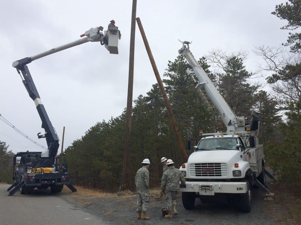 Air National Guard and Army work crews set up a utility pole during microgrid construction last month on Joint Base Cape Cod. (Courtesy Maj. Shawn Doyle)