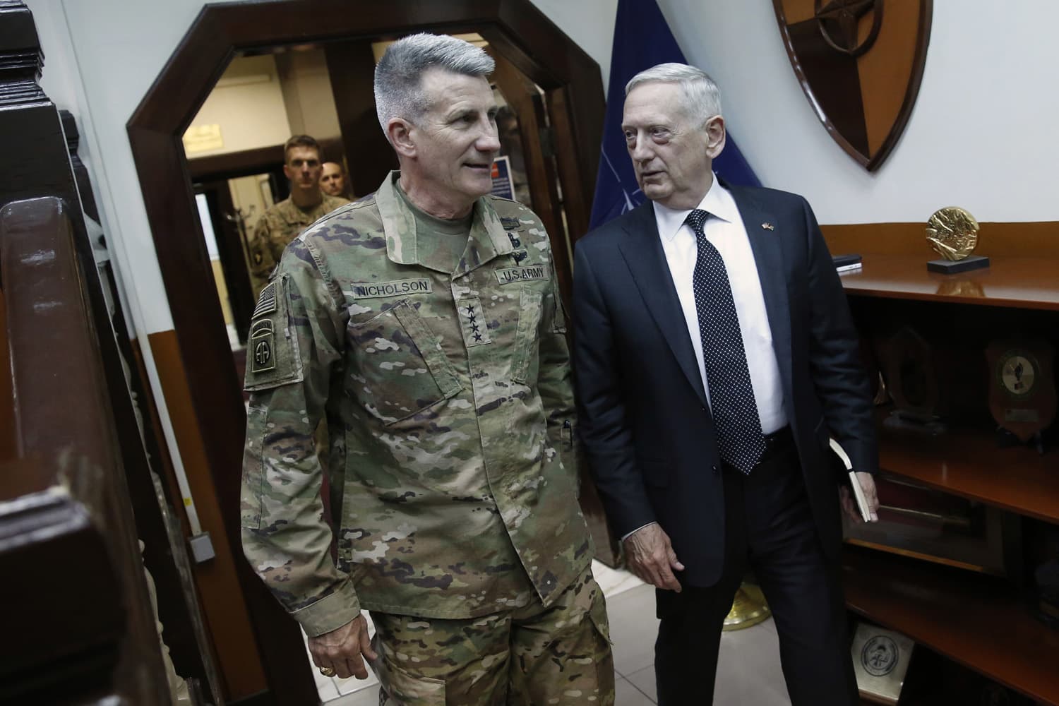 U.S. Defense Secretary James Mattis, right, and U.S. Army General John Nicholson, left, commander of U.S. Forces Afghanistan, arrive to meet with an Afghan defense delegation at Resolute Support headquarters, in Kabul Afghanistan, Monday, April 24, 2017. Mattis arrived unannounced in Afghanistan to assess America's longest war as the Trump administration weighs sending more U.S. troops. (Jonathan Ernst/AP)