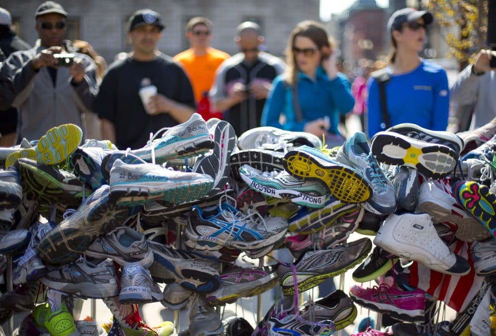 When two terrorist bombs shattered lives at the finish line of the 2013 Boston Marathon, the spirit of community was not broken and the outpouring of public support has been a significant factor in healing psychic wounds, writes Richard Beinecke. Pictured: A collection of running shoes in a makeshift memorial honoring the victims of the Boston Marathon bombing in Copley Square, Saturday, April 27, 2013, (Robert F. Bukaty/AP)
