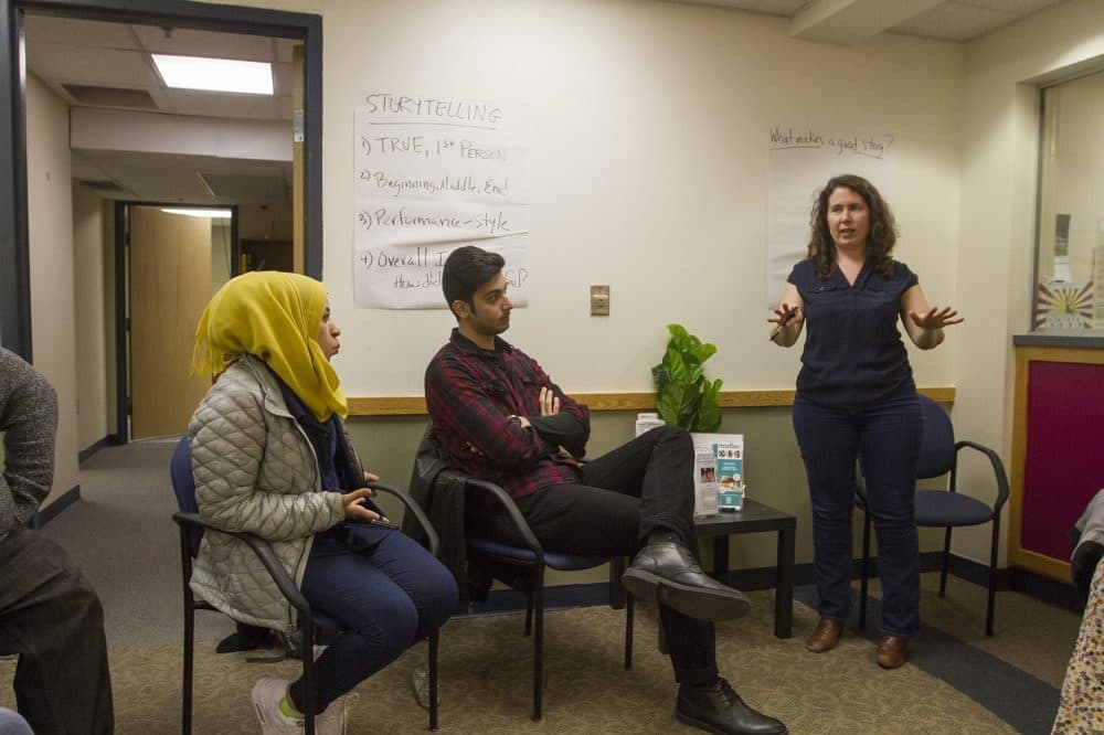 Cheryl Hamilton, director of the International Institute of New England's Lowell office and the creator of the "Suitcase Stories" series, goes over storytelling techniques. (Joe Difazio for WBUR)