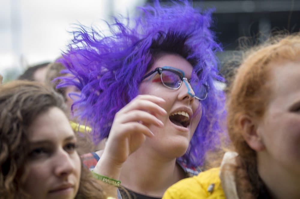 A woman in the crowd dances to Sylvan Esso. (Jesse Costa/WBUR)